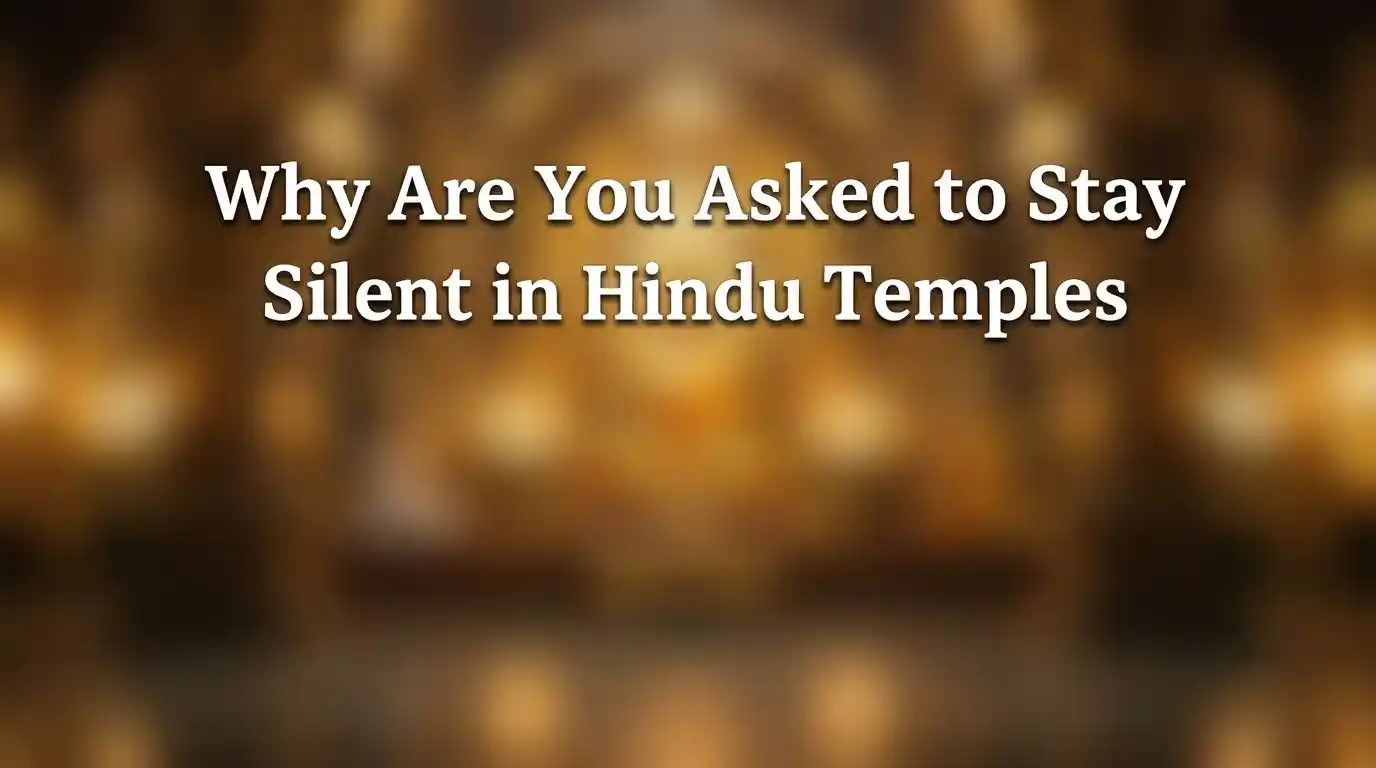 A person sitting peacefully in quiet meditation inside a sacred Hindu temple hall